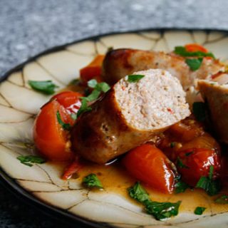 Roasted Sausages With Tomatoes, Peppers And Onions